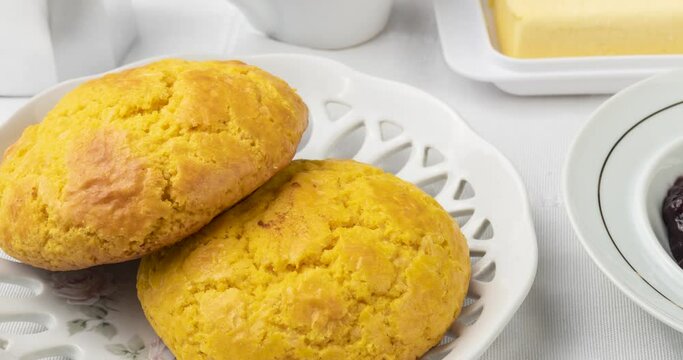 Broa, typical brazilian corn flour bread with coffee,jam and butter
