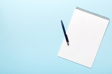 Blank notebook with pen on white background. Back to school and education concept