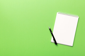 Blank notebook with pen on white background. Back to school and education concept © sosiukin