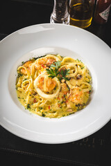 Delicious Food Contemporary Classic Dish Plate Menu Lunch Dinner Gourmet Dessert Chef Pasta Shrimp on a Dark Table