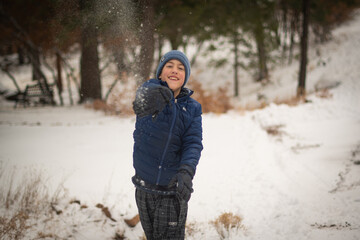 Boy in winter forest
