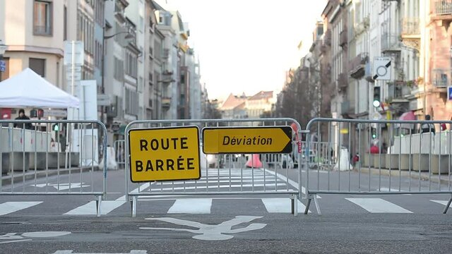 Route barree deviation translated as - closed street take other path - security gates over the main street in French city during the Christmas Market and other public event