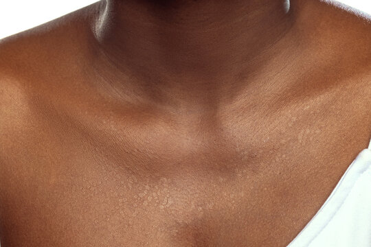 Detailed texture of female skin. Close up shot of young african-american female body. Skincare, bodycare, healthcare concept.