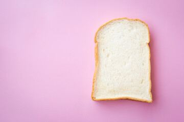 Thin sliced bread on pink background.