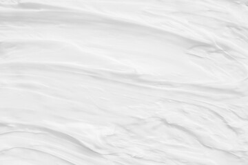 White surface of the cream lotion softens the background.