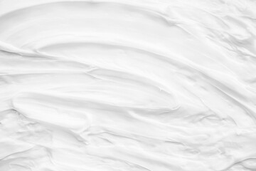 White surface of the cream lotion softens the background.