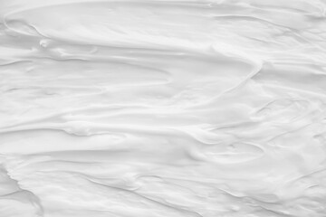 White surface of the cream lotion softens the background.