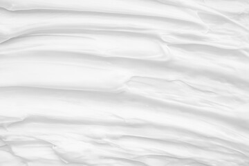 Fototapeta na wymiar White surface of the cream lotion softens the background.