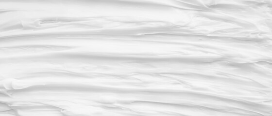 White surface of the cream lotion softens the background.