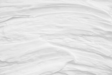 White surface of the cream lotion softens the background.