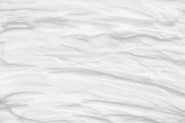 White surface of the cream lotion softens the background.