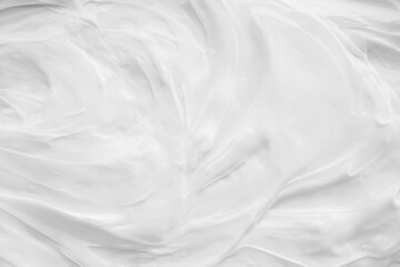 Obraz premium White surface of the cream lotion softens the background.