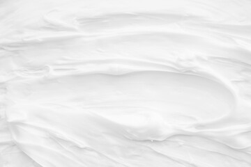 White surface of the cream lotion softens the background.