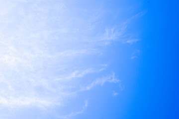 Beautiful blue sky with white smooth cloud. Beautiful light.