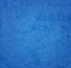 Textured background of the velour fabric is blue.