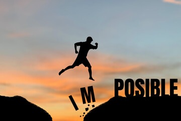 Silhouette of young man jumping over impossible to possible over cliff on sunset background. Business concept idea.