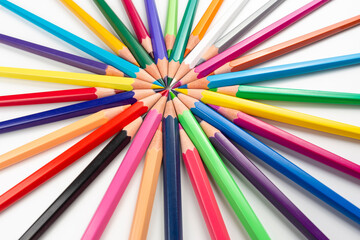 Fototapeta premium Colored pencils for drawing on a white background. Education and creativity. Leisure and art
