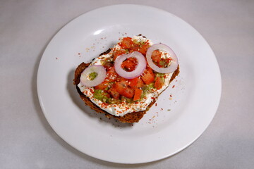 Avocado sandwiches, half of avocado, with peanuts and pumpkin seeds, onion rings, red pepper on a white background