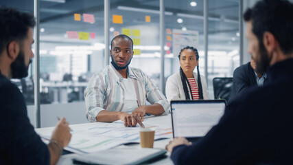 Multi-Ethnic Office Conference Room Meeting: Diverse Team of Creative Entrepreneurs, Specialists, Professional Talk, Discuss Growth. Businesspeople work on Digital e-Commerce Startup.