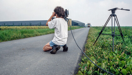 Video camera eighties with tripod. Filming on video in the eighties. Road Groningen Netherlands....