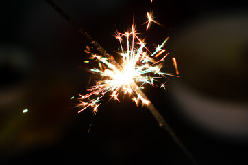 Burning sparkler background. Christmas banner with copy space. Christmas eve.