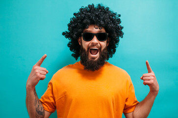 Funny bearded hipster man in wig. Smile. Crazy emotions