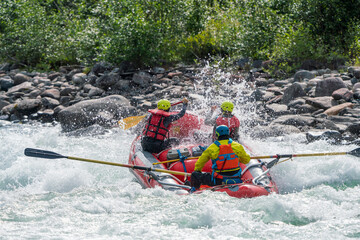 River rafting in white watered and powerful river. Extreme water sports activity concept. - obrazy, fototapety, plakaty