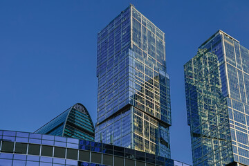 Obraz premium Skyscrapers in the business center, financial district, sunny day, blue sky, empty space, Moscow city, Russia.