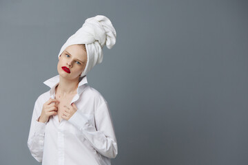 glamorous woman red lips towel on head makeup Gray background