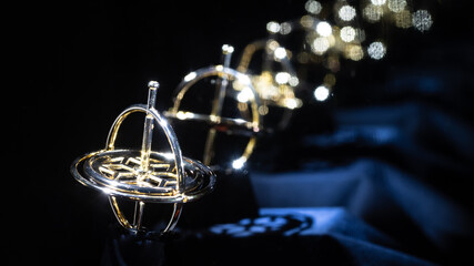 Golden Gyroscope Reflecting Endlessly in the Darkness