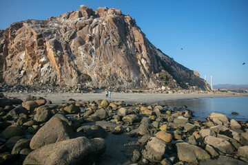 Fototapeta na wymiar A View of Morro Rock form the Jetty at the Mouth of Morro Bay, California
