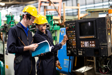 Two electrician Man Worker at industrial factory wearing uniform and hard hats and Mechanical...