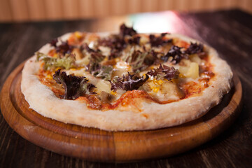 Close up of delicious vegetable pizza on a wooden table