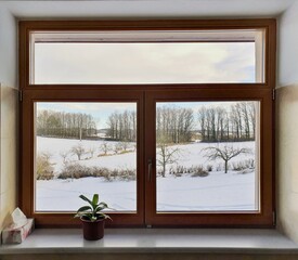 View from the window of a country house on a snowy landscape