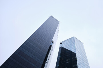 Fototapeta premium View of modern skyscrapers in the city's business district. Modern glass business buildings in the city center