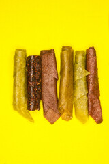 Fruit pastila, photo on a yellow background