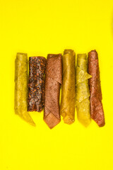 Fruit pastila, photo on a yellow background