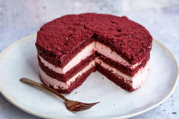 Red velvet cake, classic three layered cake from red butter sponge cakes with cream cheese 