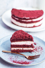 Red velvet cake, classic three layered cake from red butter sponge cakes with cream cheese 