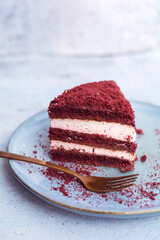 Red velvet cake, classic three layered cake from red butter sponge cakes with cream cheese 