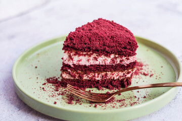 Red velvet cake, classic three layered cake from red butter sponge cakes with cream cheese 