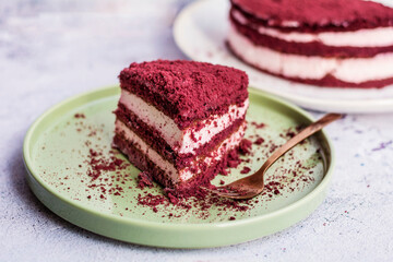 Red velvet cake, classic three layered cake from red butter sponge cakes with cream cheese 