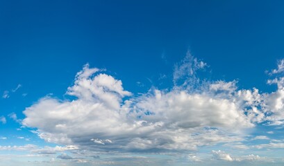 Fantastic clouds against blue sky, panorama