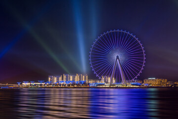 Amazing view to the Ain Dubai, giant Ferris at Bluewaters Island  close to JBR beach, world's largest observation wheel, fits perfect to modern UAE skyline. - obrazy, fototapety, plakaty