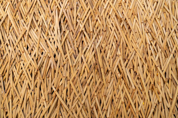 Close up to bamboo wall, the beautiful natural golden background, traditional hand made 