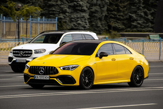 Kiev, Ukraine - June 19, 2021: Yellow Mercedes-Benz CLA 35 in the city. New model