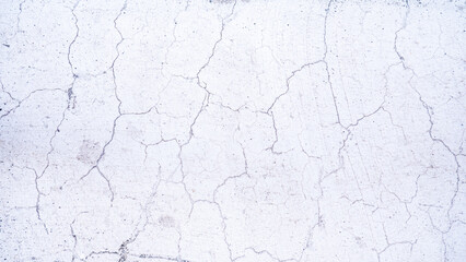 Cracks on the surface of the plaster wall or white plaster wall. Rough surfaces with cracks.