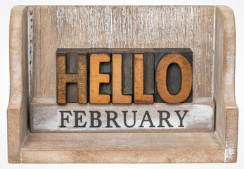 Hello February in vintage letterpress wood type inside grunge wooden box, calendar concept