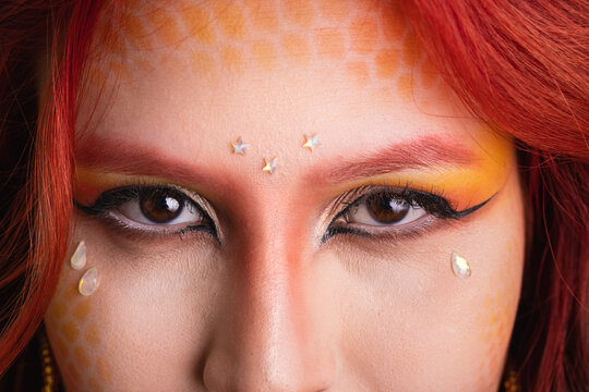 Carnaval in Brazil, detail of eyeliner and fashion makeup looking at camera on close up