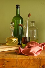 Assortment of oil and vinegar bottles on a kitchen counter